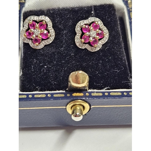 240 - A pair of 9ct Gold, Diamond and Ruby cluster Earrings.