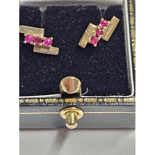 242 - A pair of 9ct Gold and Ruby set Earrings.