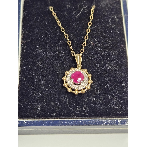 250 - A 9ct Gold, Diamond and Ruby Pendant and a 9ct Gold Chain.