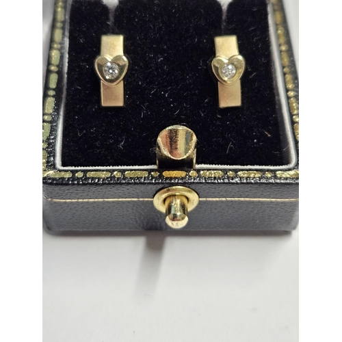 252 - A pair of 9ct Gold, Diamond set Earrings.