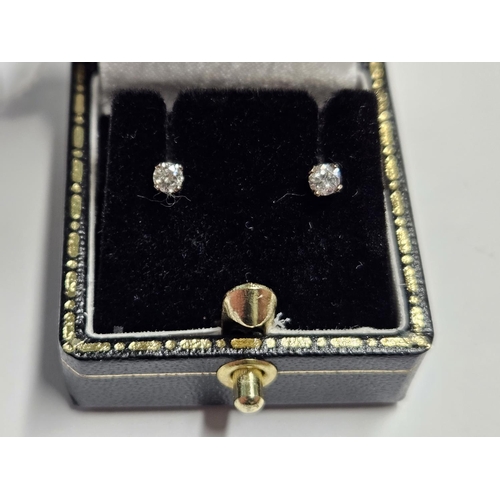 255 - A pair of 9ct Gold and Diamond stud Earrings.