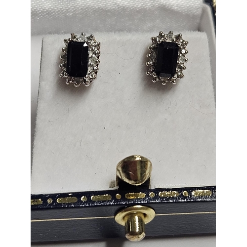 256 - A pair of 9ct Gold, Diamond and Sapphire Earrings.