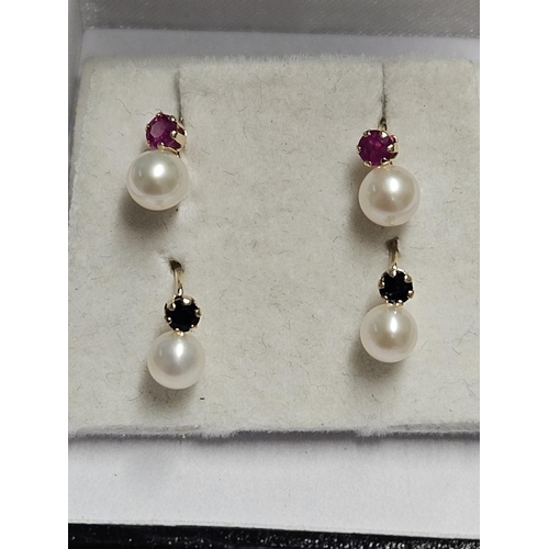 257 - Two pairs of 9ct Gold and cultured Pearls, one set with Sapphires and the other set with Ruby's.