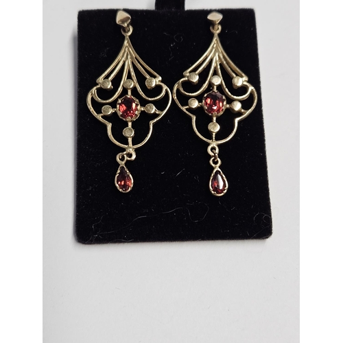 273 - A pair of 9ct Gold and Garnet multi pierced Earrings.