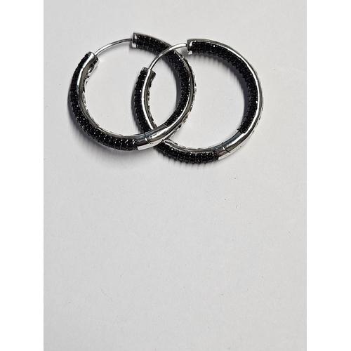 279 - A large pair of Silver and stone set hoop Earrings.