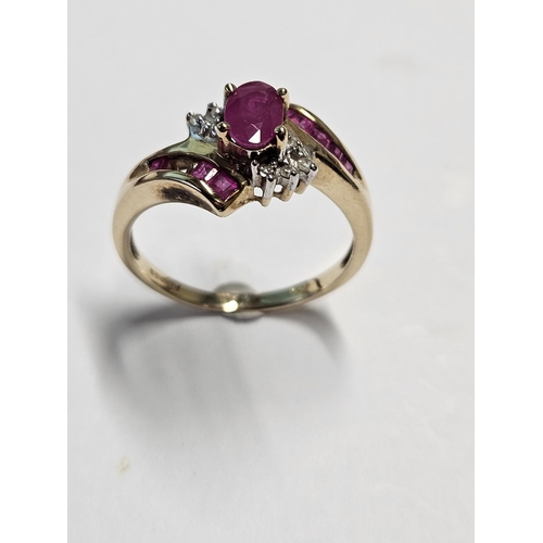 282 - A 9ct Gold, Diamond and Ruby cluster Ring, size N.