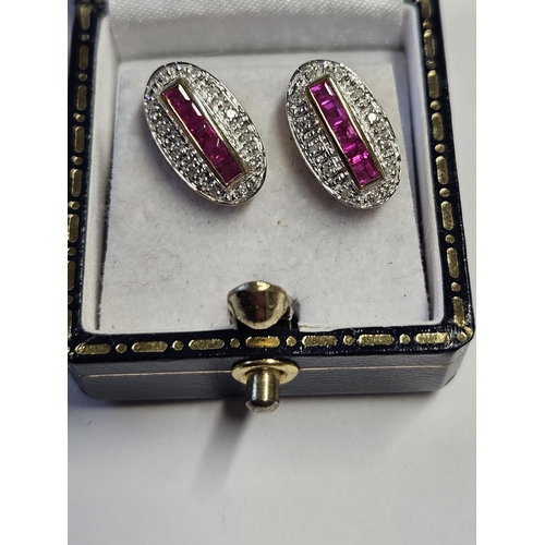 287 - A pair of 9ct Gold, Diamond and Ruby cluster Earrings.