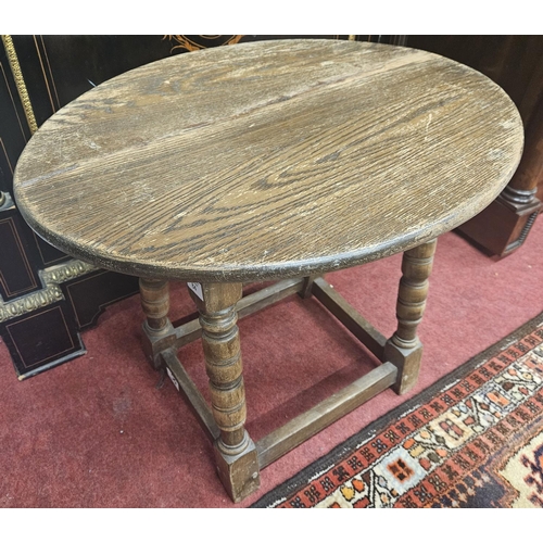 84 - An early 20th Century oval Table along with a metal Plaque. H 47 x 45 x 60 cm approx.