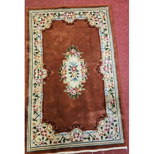 148 - A good Burgundy Rug with multi borders and allover decoration. L 200 x W 123 cm approx.