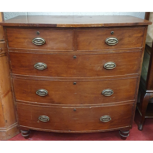 169 - An early to mid 19th Century bowfronted Chest of Drawers with oval handles on turned supports. 107 x... 