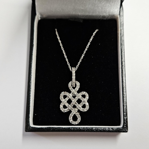 315 - A 9ct Gold and Diamond se Pendant with a 9ct Gold Chain.