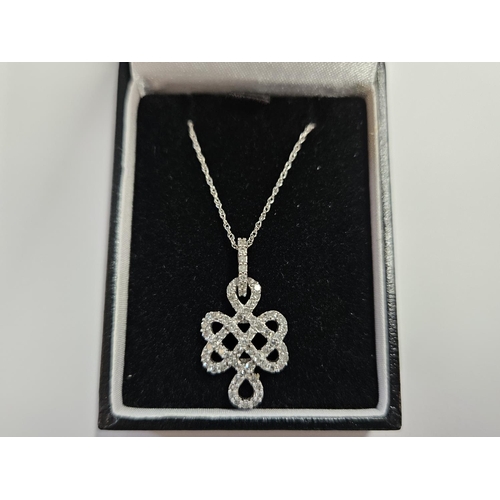 315 - A 9ct Gold and Diamond se Pendant with a 9ct Gold Chain.