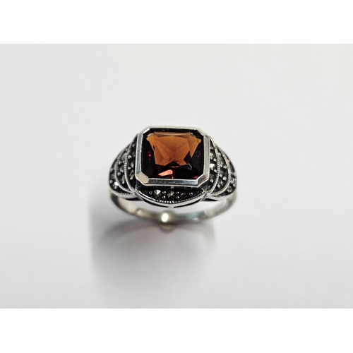 320 - A Silver, Marcasite and Garnet Ring, size L1/2.