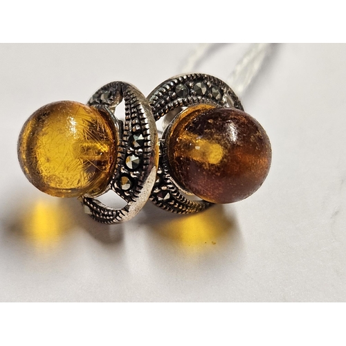 329 - A pair of Silver and Amber stud Earrings.