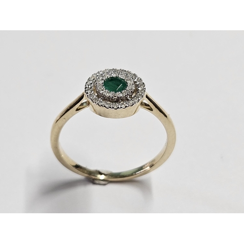 330 - A 9ct Gold, Diamond and Emerald Ring, size O.