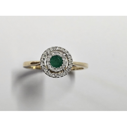 330 - A 9ct Gold, Diamond and Emerald Ring, size O.