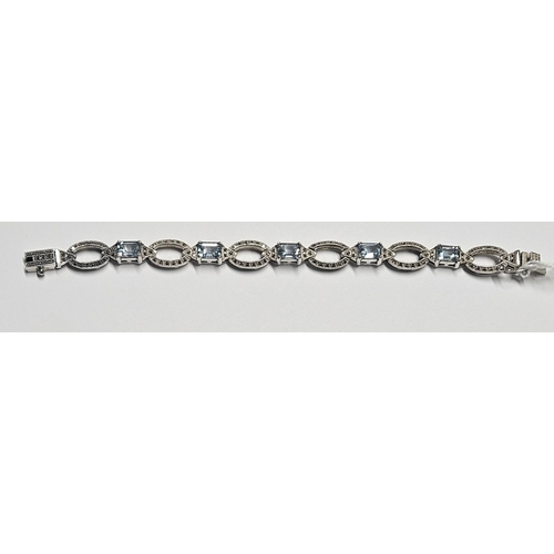 335 - A Silver and Topaz Bracelet in the antique style.