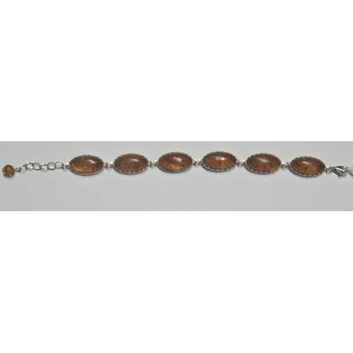 338 - An Amber Bracelet set in Silver.