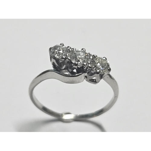 339 - An 18ct ct White Gold and Diamond three stone Ring approx .66 ct total Diamonds, size M.