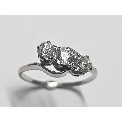 339 - An 18ct ct White Gold and Diamond three stone Ring approx .66 ct total Diamonds, size M.