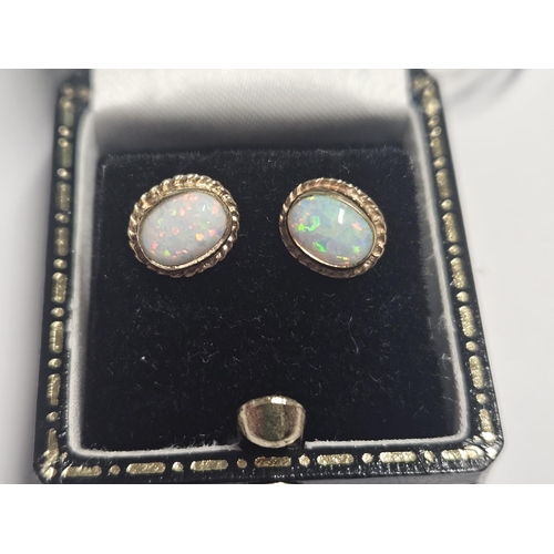 344 - A nice pair of 9ct Gold and Opel cluster Earrings.