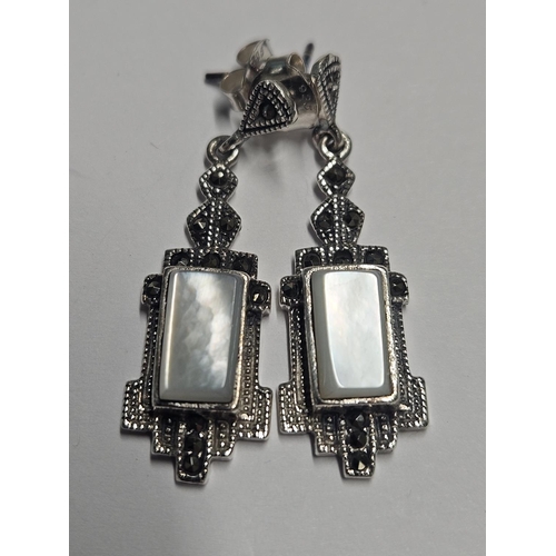 354 - A pair of Silver and Mother of Pearl drop Earrings.