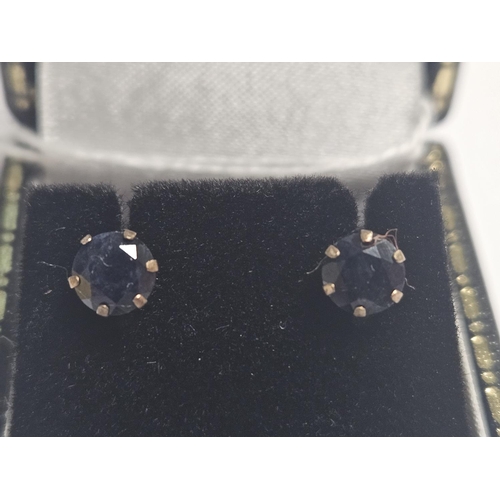 359 - A pair of 9ct Gold and Sapphire set stud Earrings.