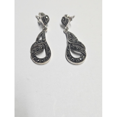 364 - A pair of Silver and Marcasite drop earrings.