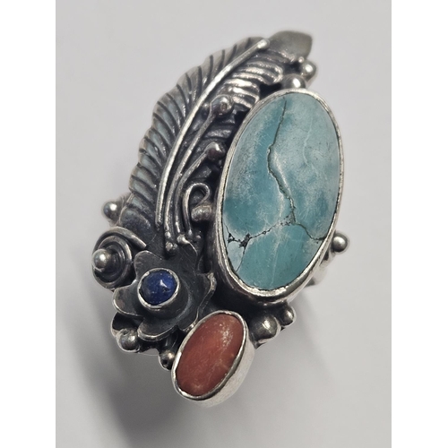 369 - A very unusual and large Silver, Turquoise and Stone set Ring, size O1/2.