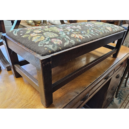 488 - An early 20th Century Oak Footstool with tapestry seated top on square supports. W 78 x 32 x H 24 cm... 