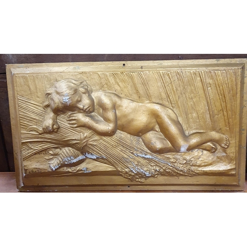 523 - A lovely pair of Gilded Wall Plaques depicting cherubs lying on sheaves of wheat. W 61 x 35 cm appro... 