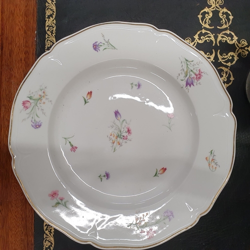 529A - A Fantastic Limoges Dinner Service with floral pattern outline and gilded banding. Approx. 70 pieces... 