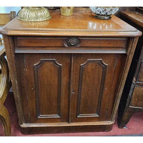 567 - An unusual 19th Century Mahogany twin door Side Cabinet of narrow proportions with single drawer fri... 