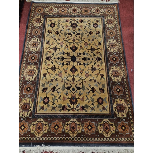 581 - A good brown ground Rug with multi borders and unique medallion design. 240 x 168cm approx.