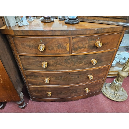 601 - A Victorian Mahogany bow fronted Chest of Drawers with original turned knobs with mother of pearl in... 