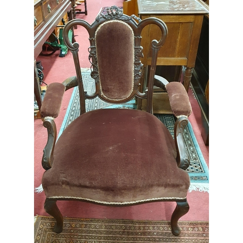 627 - A pair of late 19th early 20th Century Mahogany showframe Armchairs on cabriole front supports.
W 60... 