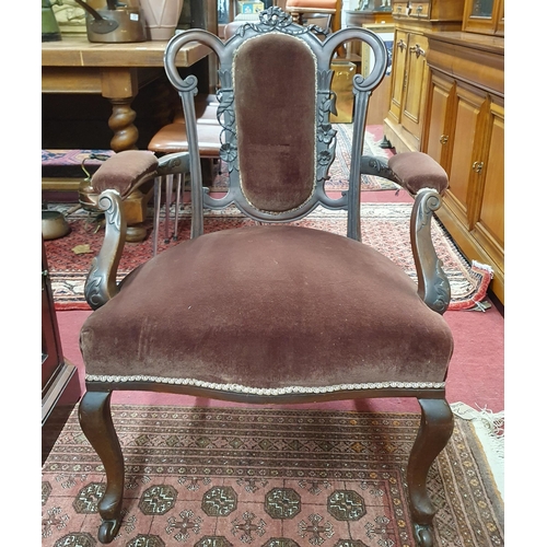 627 - A pair of late 19th early 20th Century Mahogany showframe Armchairs on cabriole front supports.
W 60... 