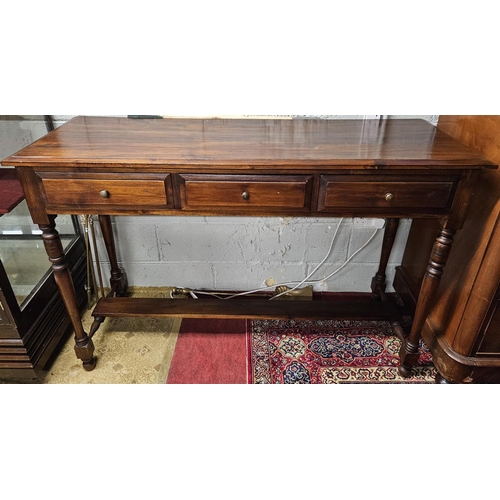 697 - A modern Mahogany rectangular Side Table with triple frieze drawer on turned supports and stretcher ... 