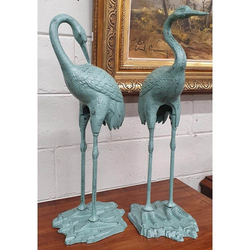 717 - A good pair of cast Metal Cranes. H 76 cm approx.