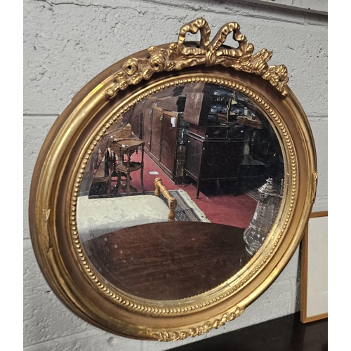 721 - A good circular Timber and plaster Gilt mirror with bevelled mirror glass. D 67 cm approx.