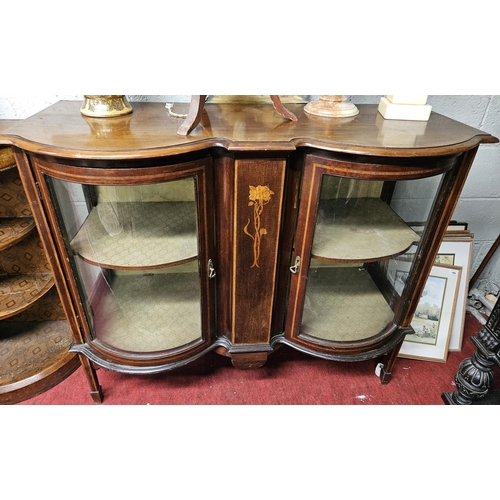 768 - An Edwardian Mahogany double bow fronted Display Cabinet with inlaid front on square tapered support... 