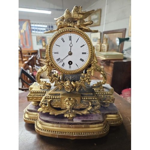 819 - A good 19th Century Ormolu Mantel Clock with highly moulded outline on platform base.