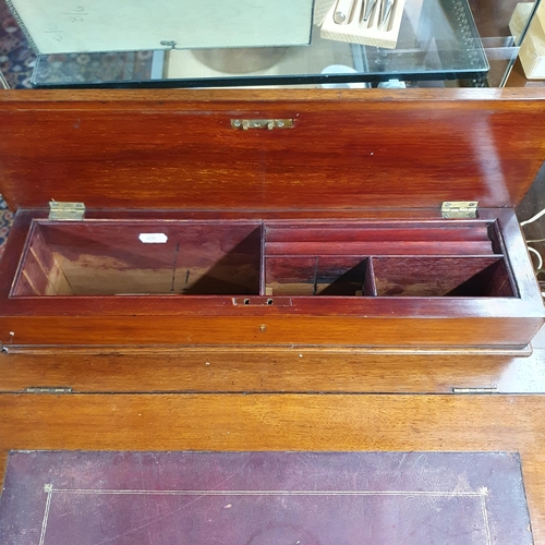 858 - Of good quality. A late 19th Century Walnut Davenport with four real and four dummy drawers on turne... 