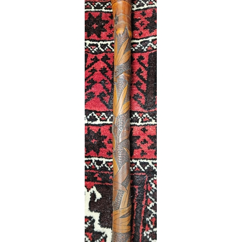 912A - A really good 19th Century Walking Cane with highly carved shaft and burr walnut knotted top.