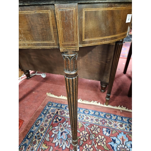 940 - A good Regency Mahogany and Inlaid foldover Card Table on turned reeded supports in the Gillows styl... 