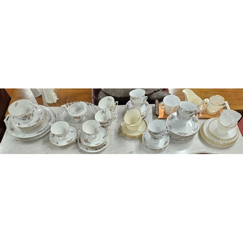 951 - An extremely large quantity of Porcelain, Pottery items on two shelves.