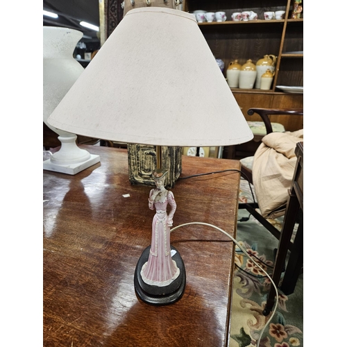 975 - A good quantity of four table Lamps to include a troica style table Lamp.