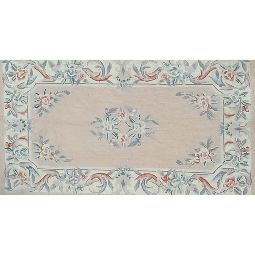 995B - A pink ground Aubusson style Wall hanging.
L 145 x W 84 cm approx.