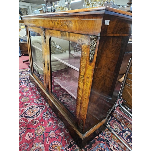 1045 - A superb Victorian Walnut and inlaid two door side Cabinet with twin panel glazed doors, ormolu moun... 