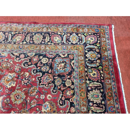 1051 - A deep Red ground Marshfield Carpet with a central medallion design and a deep border. 395 x 300 cm ... 